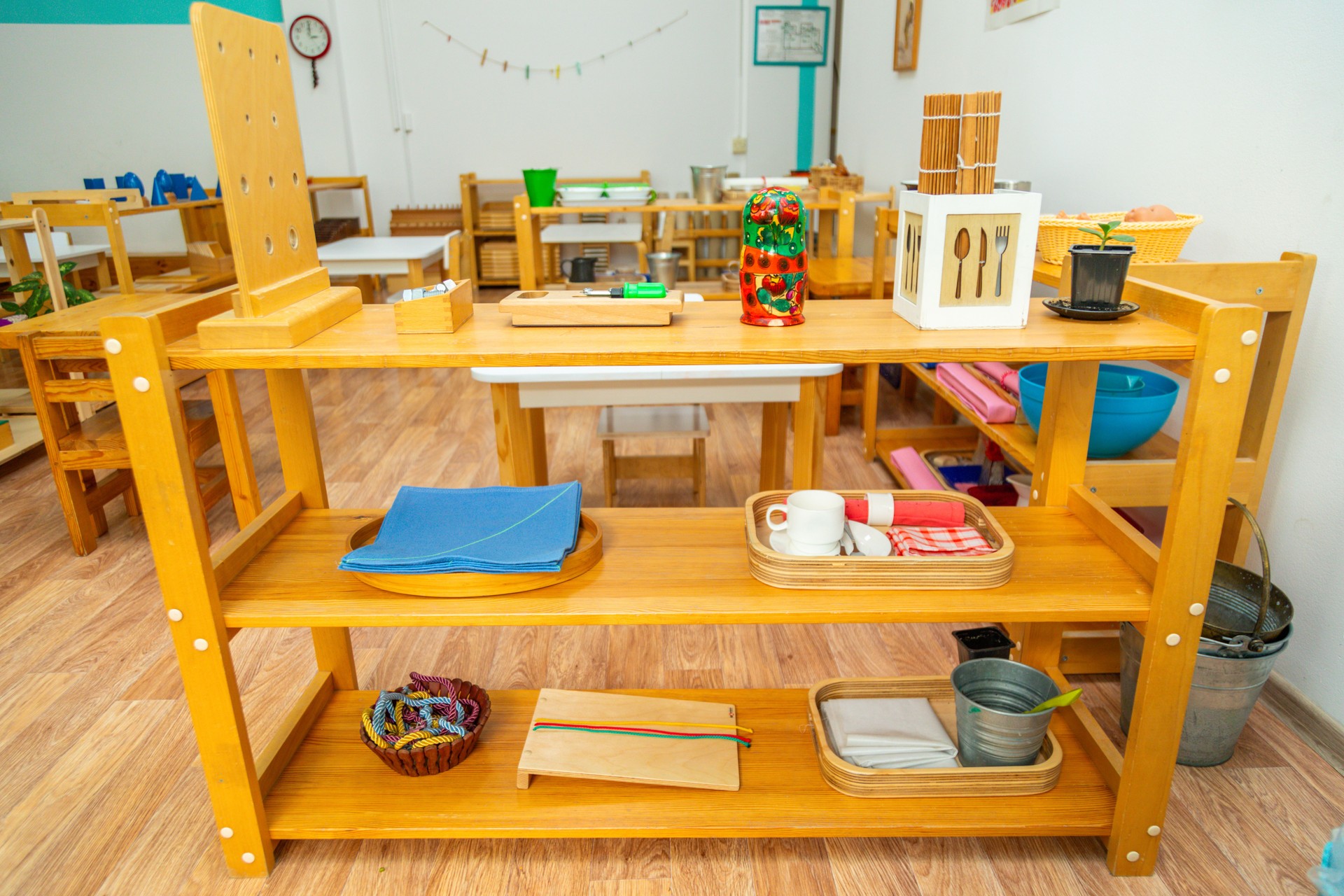 organized wooden shelves and educational materials